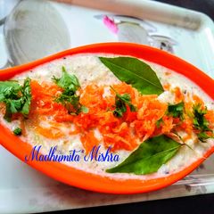 A picture of Cucumber, Carrot Raita with Curd.