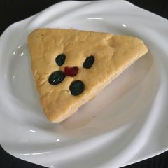A picture of Coconut cake with cherries.