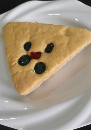 A picture of Coconut cake with cherries.