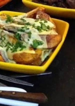 Una foto de Salsa de queso para papas