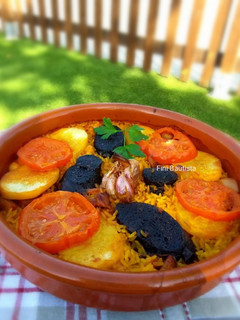 Una foto de Arroz al horno con jamón y morcilla de arroz