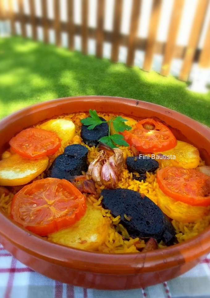 Una foto de Arroz al horno con jamón y morcilla de arroz