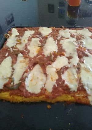 Una foto de Pizza de polenta. Súper rica