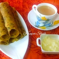 A picture of Thepla with ghee and tea.