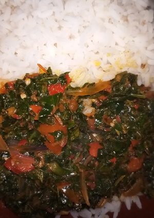 A picture of White rice and vegetable sauce.