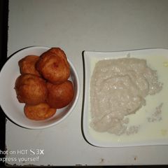 Tomato sautéed bean cake and groundnut rice puddy A picture of Tomato sautéed bean cake and groundnut rice puddy.