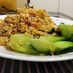 A picture of Salmon Rice With Tomato Ricotta Pesto.