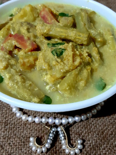 A picture of Avial Kerala style mixed vegetable curry with coconut & curd.