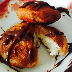 A picture of Fried ice-cream with chocolate sauce.