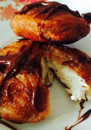 A picture of Fried ice-cream with chocolate sauce.