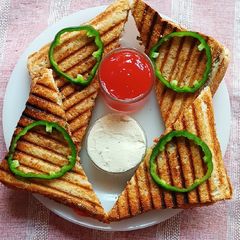 A picture of Cheese spread salad grilled sandwich.
