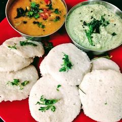Steamed Idli with chutney and sambar A picture of Steamed Idli with chutney and sambar.