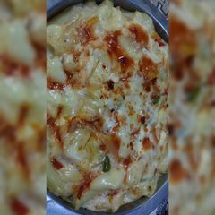A picture of Cheesy white sauce pasta.