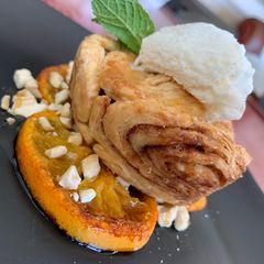 Apple pie with camarelized naartjie & cashew nut base A picture of Apple pie with camarelized naartjie & cashew nut base.