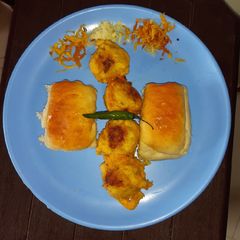 A picture of Potato fritters or pav/ vada pav.