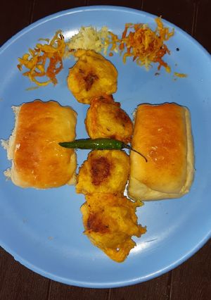 A picture of Potato fritters or pav/ vada pav.