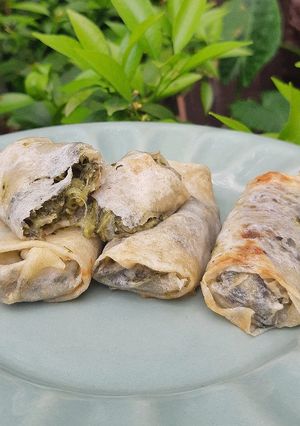 Una foto de Paquetitos de acelga y salsa blanca