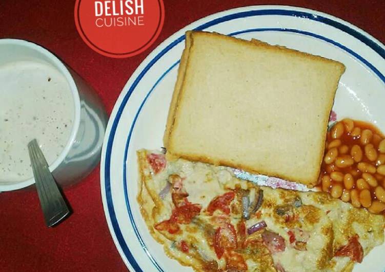 Bread &amp; fried eggs with a cup of tea