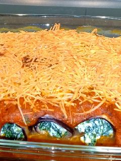 Una foto de Canelones de berenjena rellenos de espinacas y ricota 🇮🇹