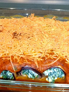 Una foto de Canelones de berenjena rellenos de espinacas y ricota 🇮🇹
