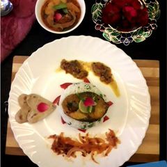A picture of Coconut fish curry with mutter pulao.