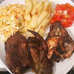 A picture of Fried Chicken,  Chips with Kachumbari.