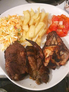 A picture of Fried Chicken,  Chips with Kachumbari.
