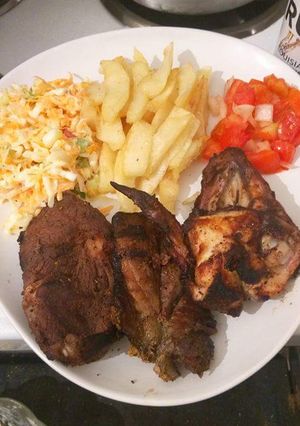 A picture of Fried Chicken,  Chips with Kachumbari.
