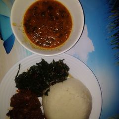 A picture of Goat meat wetfry served with ugali n spinach.