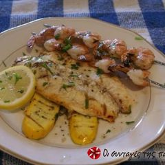 A picture of Sole in the oven with potatoes.