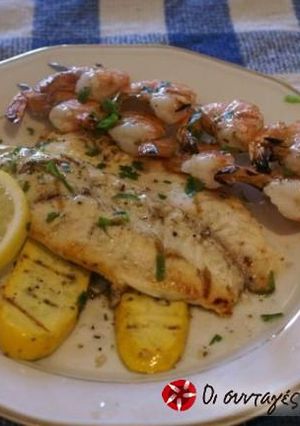 A picture of Sole in the oven with potatoes.