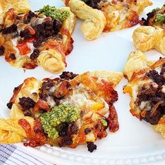 A picture of Wagyu Beef Sweet Italian Sausage, Tomato, and Pesto Puff Pastrie.
