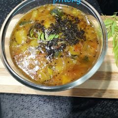A picture of Sambhar in pressure cooker.