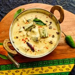 A picture of Vendakkai Mor Kuzhambu/ Crispy Okra cooked in Yogurt curry.