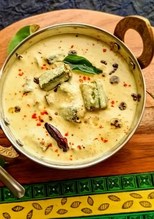 A picture of Vendakkai Mor Kuzhambu/ Crispy Okra cooked in Yogurt curry.