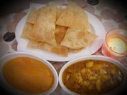 A picture of suji ka halwa with puri