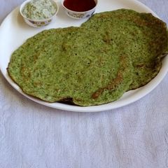 A picture of Perasattu whole moong dosa.