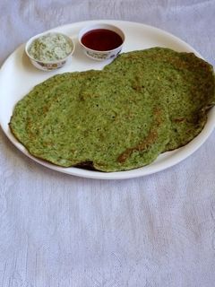 A picture of Perasattu whole moong dosa.