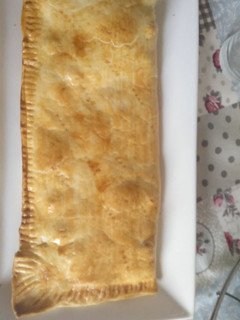 Una foto de Empanada de pollo al curry