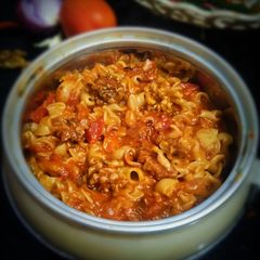 A picture of Tomato pasta with walnut twist.