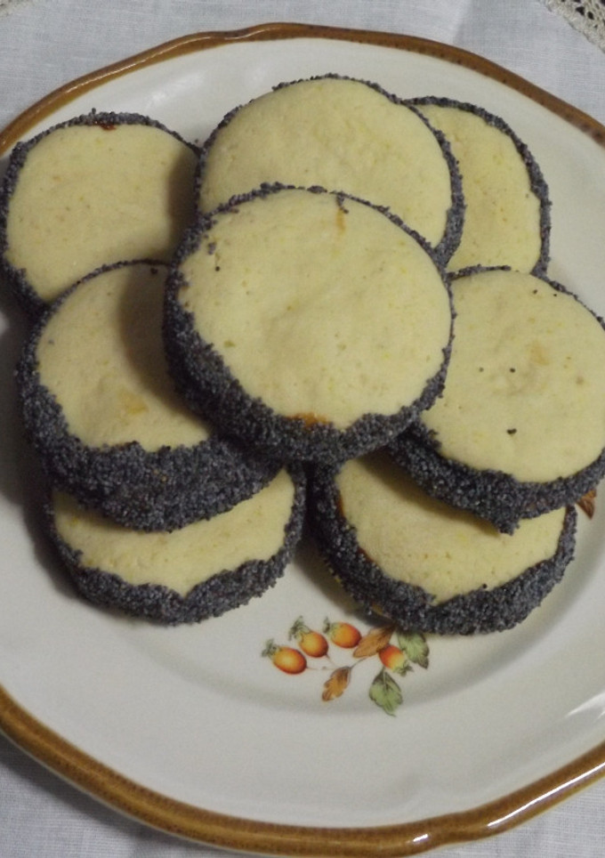 Una foto de Alfajorcitos con dulce de leche al chocolate y semillas de amapolas