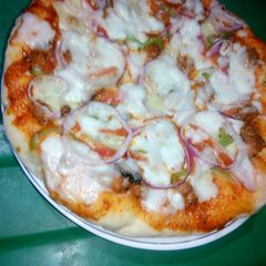 Chicken tikka pizza A picture of Chicken tikka pizza.