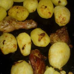 A picture of Roast potatoes and chicken marinade.