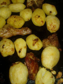 A picture of Roast potatoes and chicken marinade.