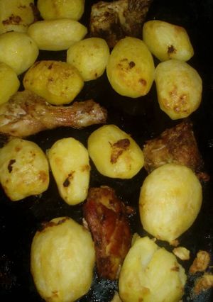 A picture of Roast potatoes and chicken marinade.
