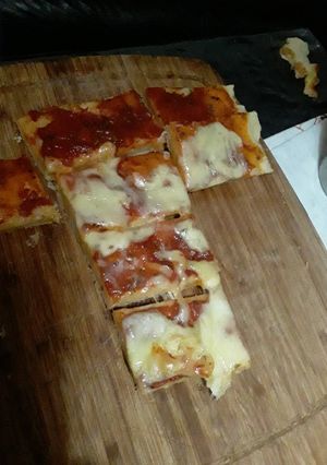 Una foto de Pizza con muza
