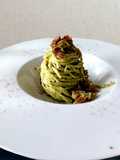 Tagliolini al pesto di valerianella (songino) e bacon