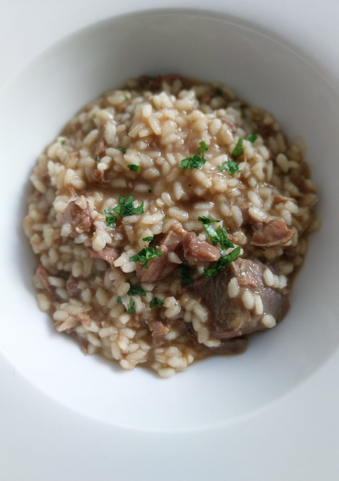 Una foto de Arroz meloso de carrilleras al horno