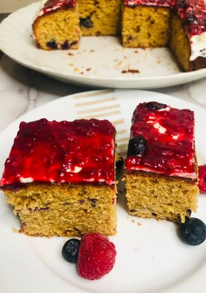 A picture of Blueberry cake with mixed berry compote.
