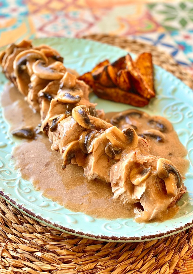 Una foto de Solomillo de cerdo con salsa de champiñones